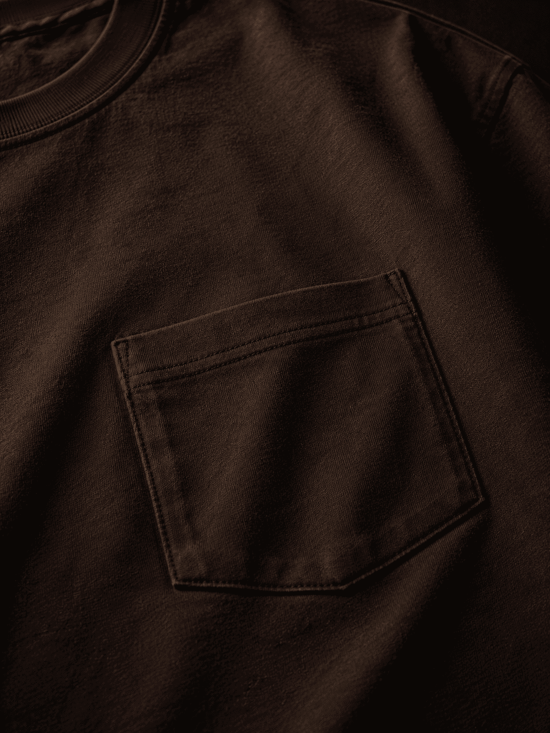 Pocket tee in espresso, detail crop of the chest pocket